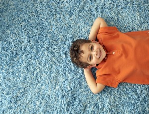 Boy Lying on Rug